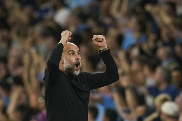 Guardiola returns to Man City after recovering from back operation