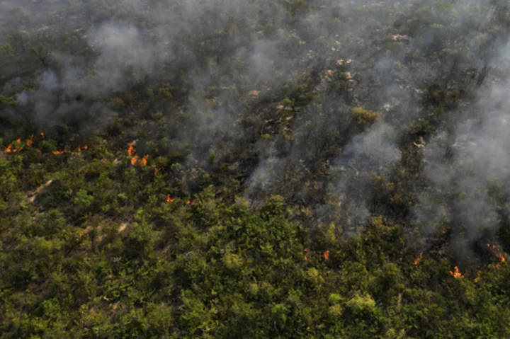 Brazil’s firefighters battle wildfires raging during rare late-winter heat wave