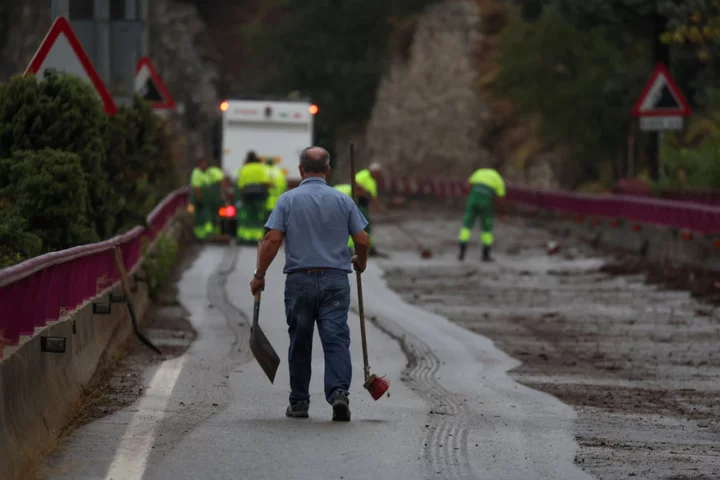 Madrid flooding puts city in lockdown as desperate search underway for missing father and son