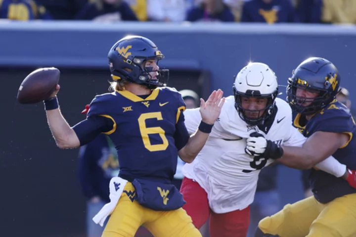 Jahiem White and Garrett Greene run wild in West Virginia's 42-21 romp over Cincinnati