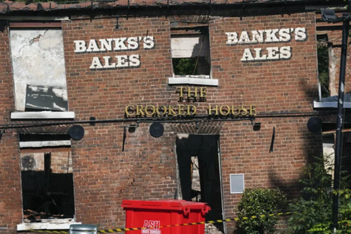 A fire at one of Britain's quirkiest pubs that was later demolished is being treated as arson