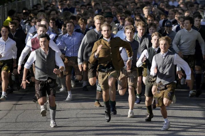 Beer flows and crowds descend on Munich for the official start of Oktoberfest