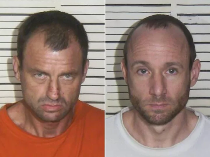 Tennessee inmate captured while another remains at large after the pair broke out through a jail ceiling, authorities say