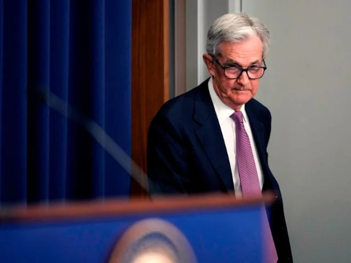 The Fed hikes interest rates by a quarter point and hints at another increase this year