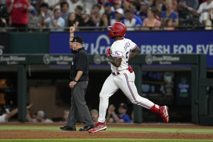 Garcia extends MLB lead in RBIs, Rangers beat Braves 7-4