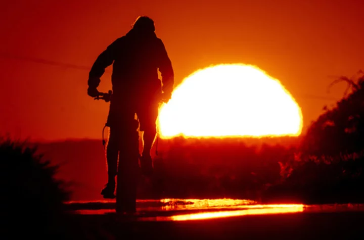 AP PHOTOS: Record-breaking heat scorches communities around the world