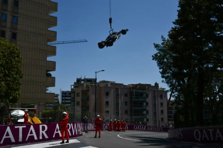 Delighted Hamilton survives crash to take sixth