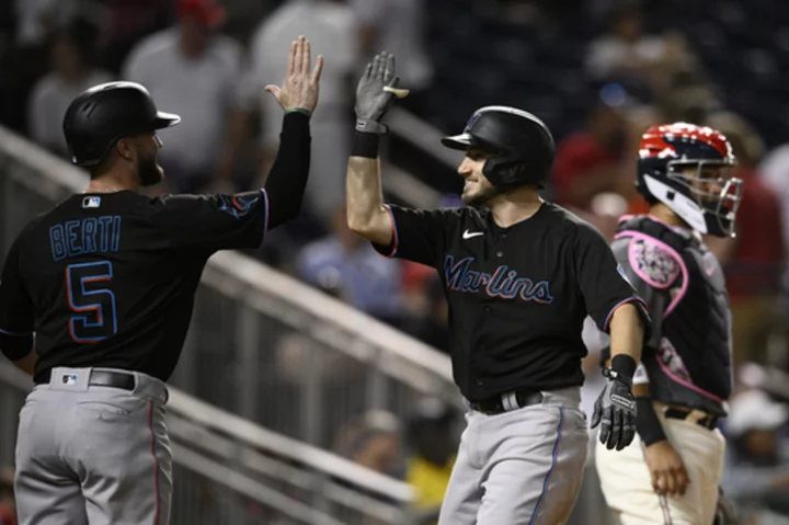 Hampson's 2-run HR caps 11th inning rally and sends Marlins past Nationals 8-5