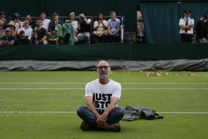 Environmental activists disrupt play at Wimbledon during match on Court 18 and get arrested