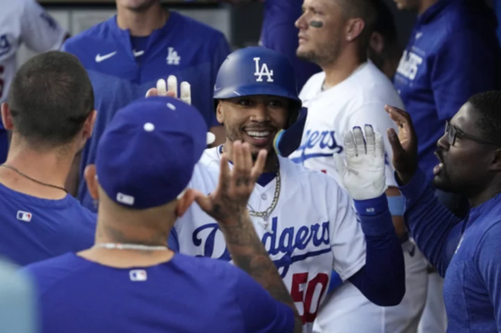 Betts hits two of Dodgers' five homers and drives in four runs in 11-4 victory over Angels