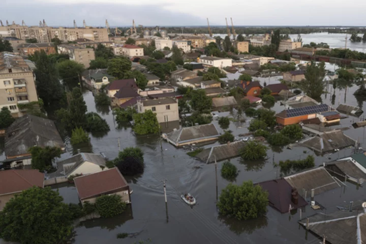 Zelenskyy visits area flooded by destroyed dam as five reported dead in Russian-occupied city