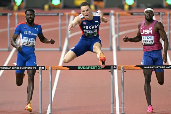 Warholm 'turns on turbos' to win third world 400m hurdles title