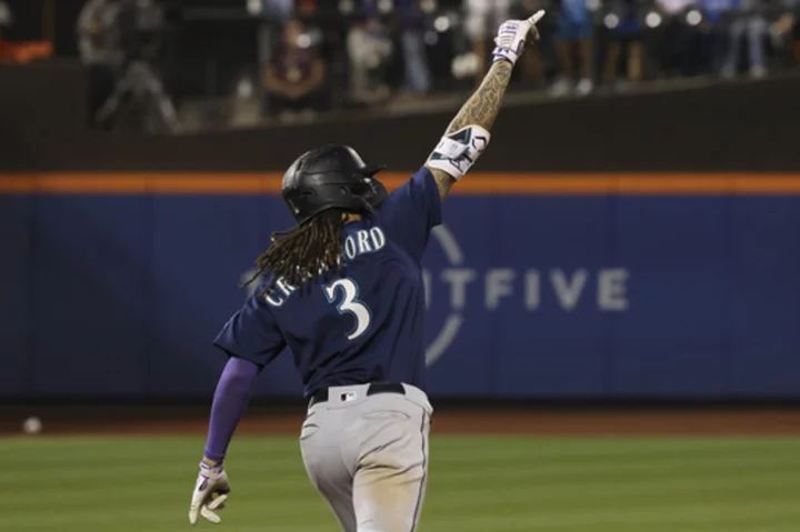 Crawford's tiebreaking homer in 9th lifts 1st-place Mariners to 8-7 win over Mets