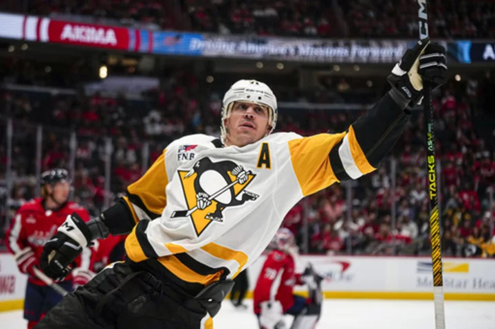 Crosby and Malkin lead the way as the Penguins beat the Capitals for their first win of the season