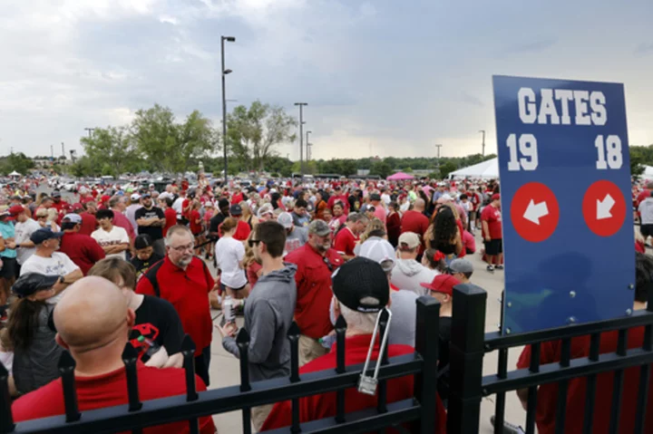 Lightning delays slow action at the Women's College World Series