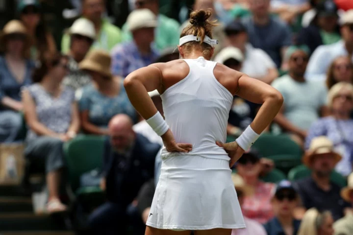 Rybakina into Wimbledon last-eight after rival quits in tears