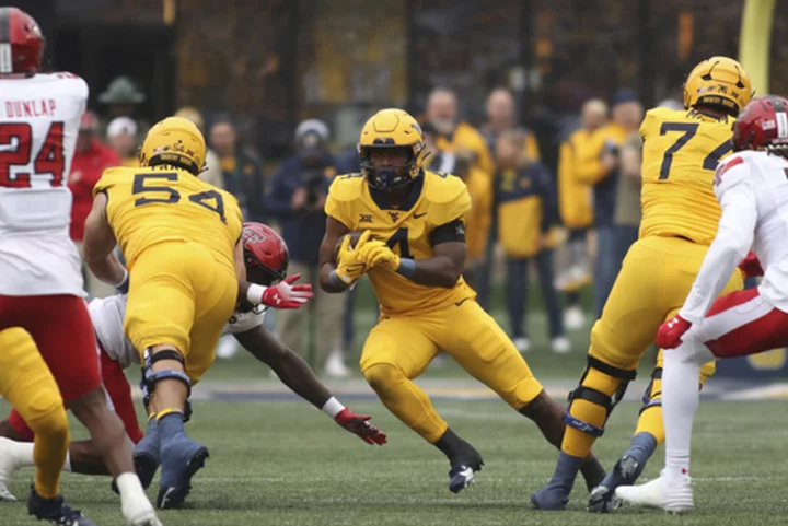 Nicco Marchiol throws TD pass in 1st start, West Virginia holds off Texas Tech 20-13