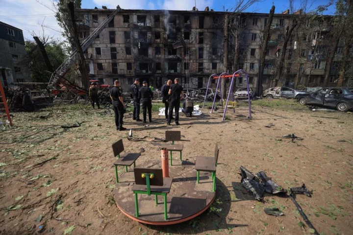 Russian missile attack kills 11 in Ukrainian president's hometown