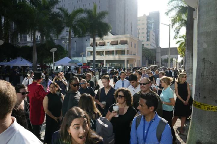 Outside of Miami court where Trump will appear, hundreds of media and crowds await former president