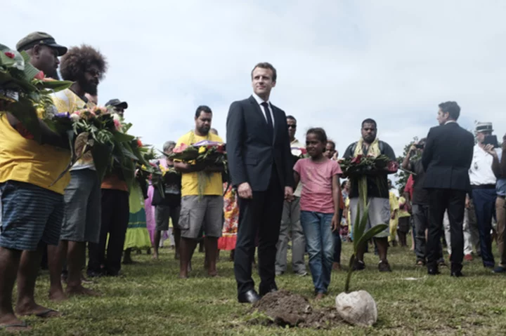 Macron promotes French interests on a trip to South Pacific where US-China rivalry is intensifying