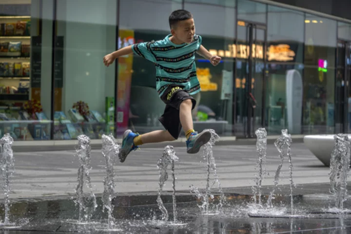 Flooding displaces 10,000 around China as Beijing gets a slight respite from an extreme heat wave