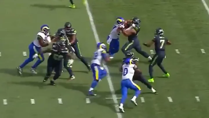 Geno Smith Shouts 'Oh My God' as Aaron Donald Runs Full Speed in His Direction