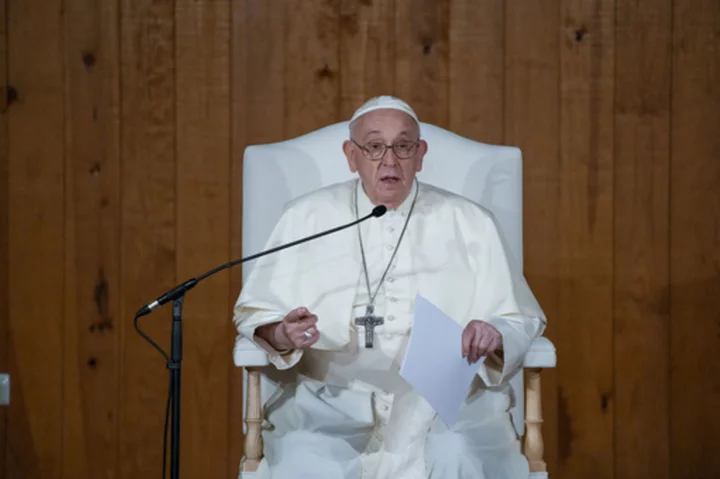 Pope visits a once-troubled Lisbon neighborhood and says true charity must 'get your hands dirty'