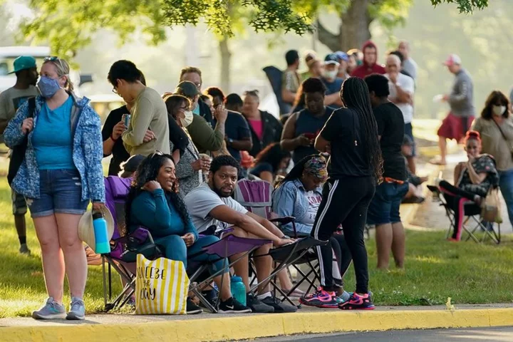 U.S. jobless claims hold steady at 20-month high, current account gap widens