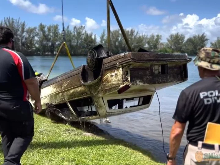 Authorities are investigating approximately 30 submerged vehicles found in a South Florida lake