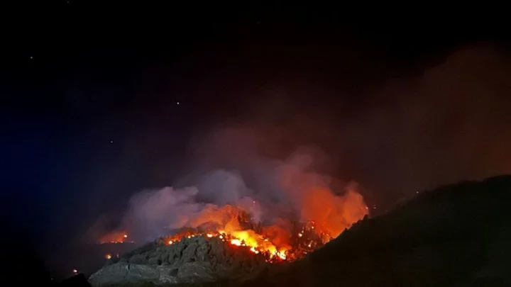 Swiss police evacuate villages due to wildfire