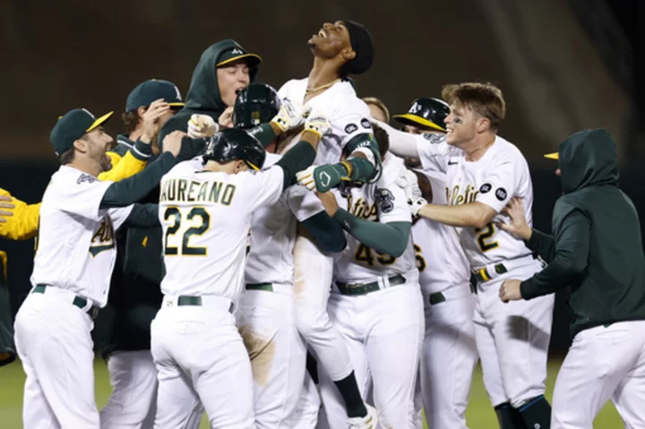 Noda hits tying grand slam in 7th, A's beat Diamondbacks 9-8 in 12 innings