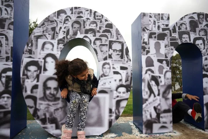 White daisies bloom in Uruguay's streets, in memory of dictatorship missing