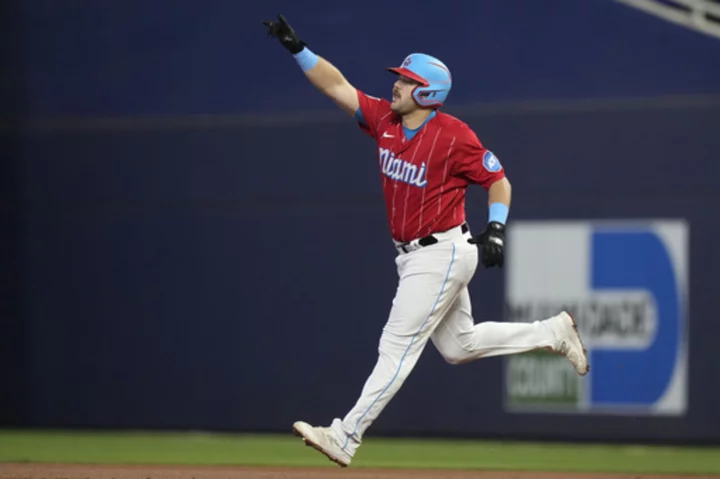 Marlins prevent Brewers from clinching NL Central with 5-4 win and stay in the wild-card hunt