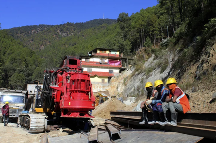 Digging to rescue 41 workers trapped in a collapsed tunnel in India halted after machine breaks