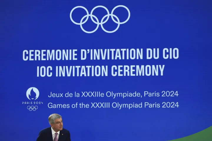 Olympic president invokes John Lennon's memory as Paris marks 1-year countdown to war-clouded Games