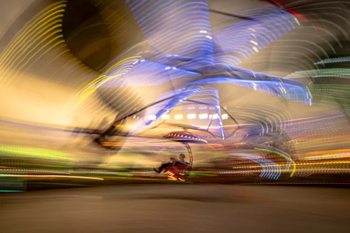 AP PHOTOS: Traditional autumn fair brings color and joy into everyday lives of Romania's poor