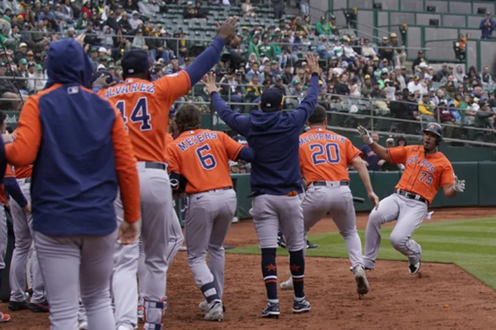 Alvarez hits 2 of Astros' 7 HRs in 10-1 win over A's, who fall to 10-45