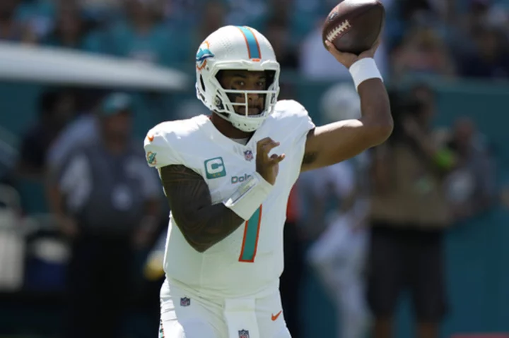 Tua Tagovailoa throws 3 TD passes to rally the Dolphins past the Panthers 42-21