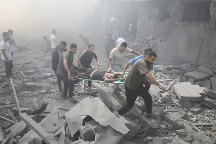 AP PHOTOS: Devastating airstrikes and humanitarian crisis in war’s 6th day