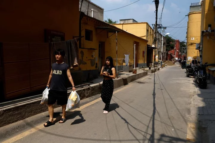 Chinese cities brace for floods as heat scorches inland regions