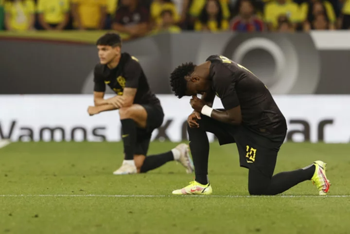 Vinícius and Brazil teammates wear black shirts in stand against racism