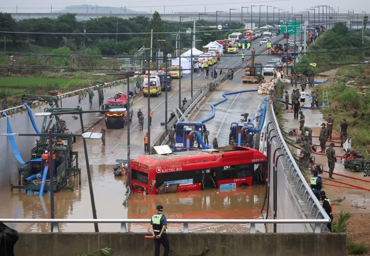 Rescuers retrieve eight bodies from flooded South Korea underpass