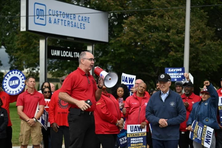 US auto union expands strike after GM profits top estimates