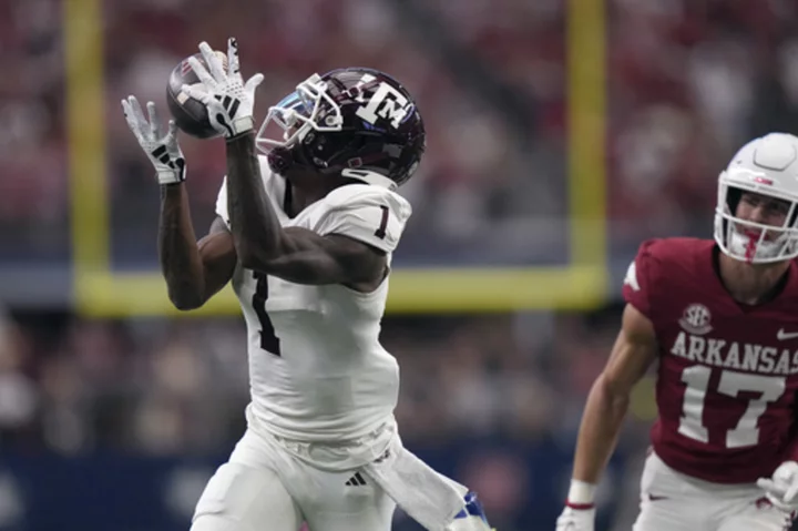 Max Johnson throws 2 TD passes for Texas A&M in 34-22 win as Arkansas held to 174 total yards