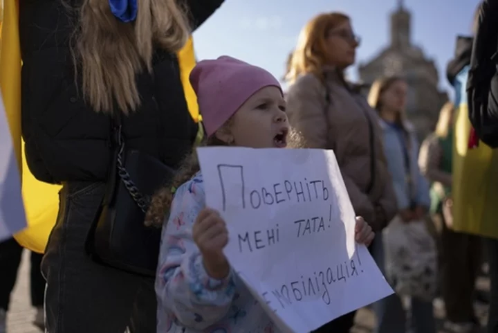 War-weary mothers, wives and children of Ukrainian soldiers demand a cap on military service time