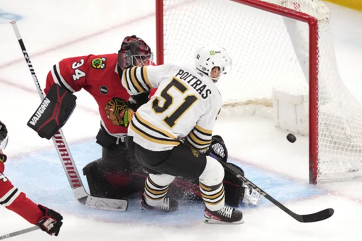 Poitras and Frederic help undefeated Boston Bruins blank Chicago Blackhawks 3-0