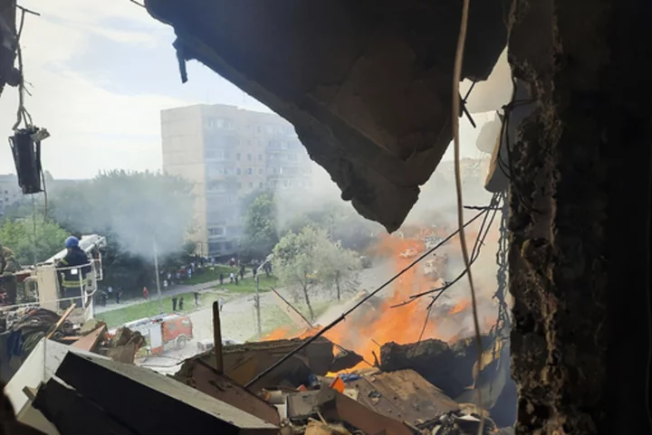 Ukraine says Russian missiles hit another apartment building and likely trapped people under rubble