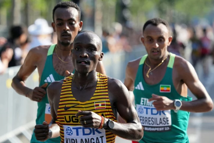 Uganda's Kiplangat wins men's world marathon title