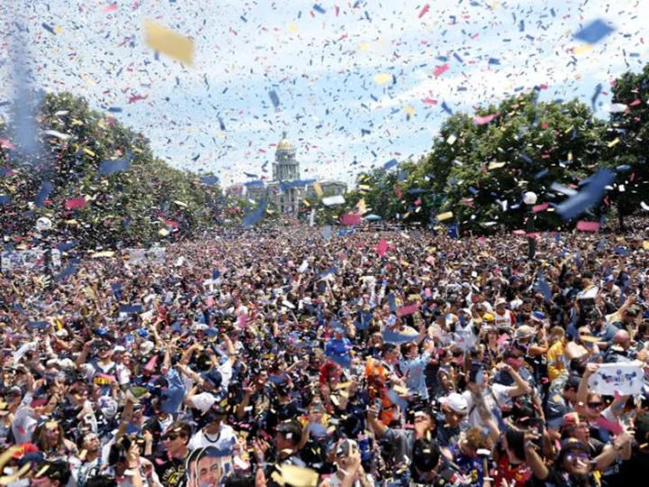 An officer's leg was run over by a fire truck during the Denver Nuggets victory parade. Later, 2 people were shot as fans left downtown