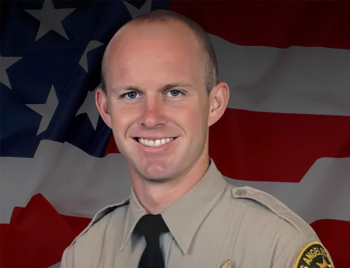 A 'person of interest' has been detained in the killing of a Los Angeles County sheriff's deputy